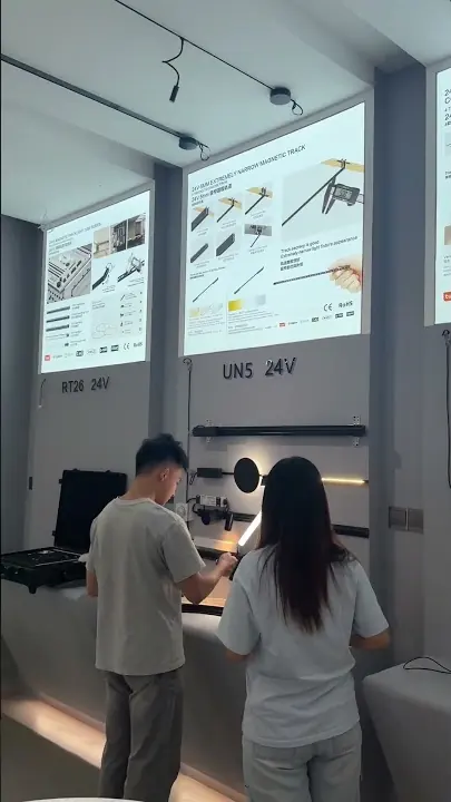 Commercial lighting showroom at FANXING LIGHTING featuring lighting fixtures and dimming demonstrations.